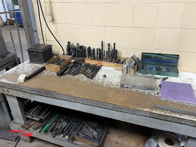 Lot 1-12439 - (1) 72" width x 33" height x 27" depth wood work bench with contents, includes assorted drill bits, ...