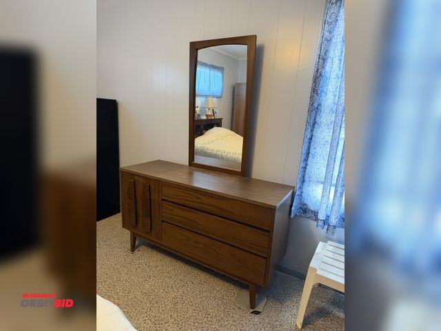 Lot 1-12161 - (1) 53" x 18" deep wood dresser with mirror.