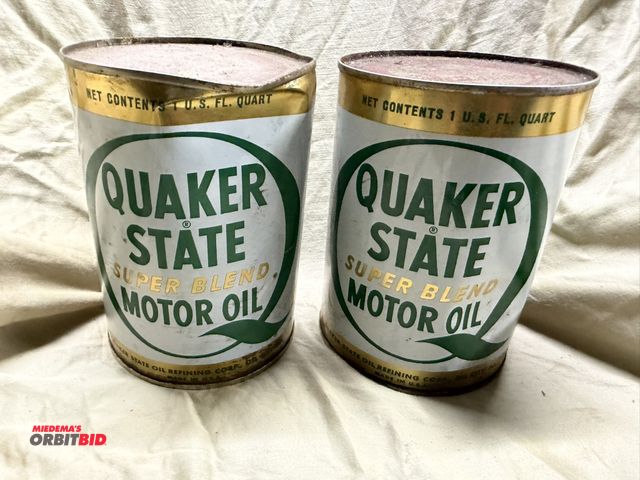 Lot 1-8293 - Lot of (2) original vintage (year unknown) Quaker State motor oil cans, unopened with oil.