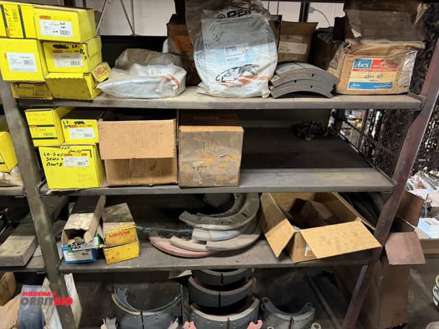 Lot 1-18607 - Contents of (3) shelves and floor, includes assorted new brake shoes, assorted Euclid brake kits, pa...