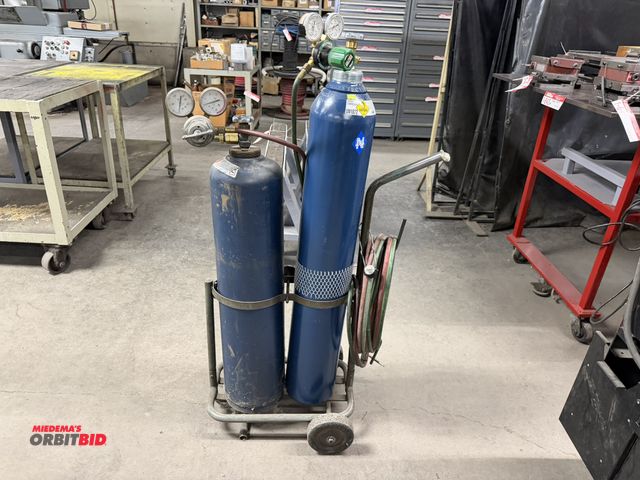 Lot 1-853 - (1) torch cutting unit, includes oxygen and acetylene bottles, regulators, torch hose, striker, and ...