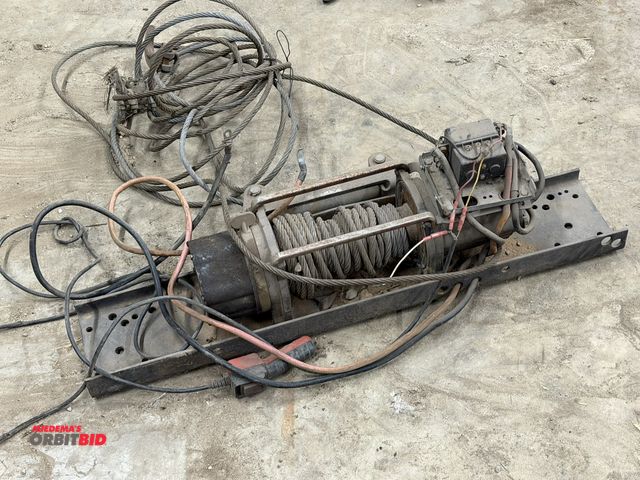 Lot 1-1455 - (1) make and model unknown 12V steel cable type winch, working condition unknown, appears to need mi...