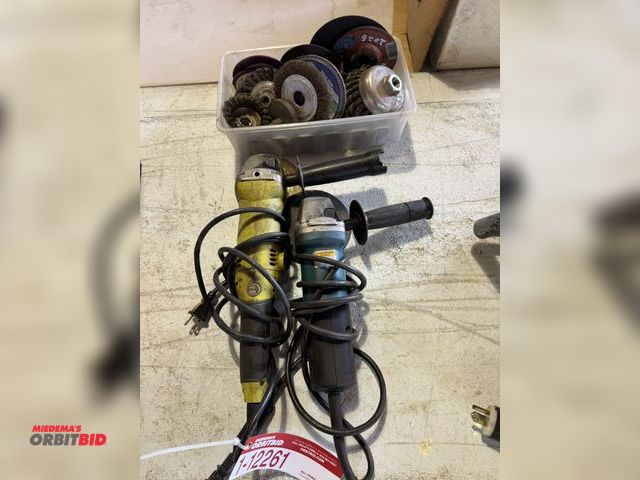 Lot 1-12261 - Lot of (2) 4.5" angle grinders, Makita &amp; Ryobi, with assorted grinding attachments.