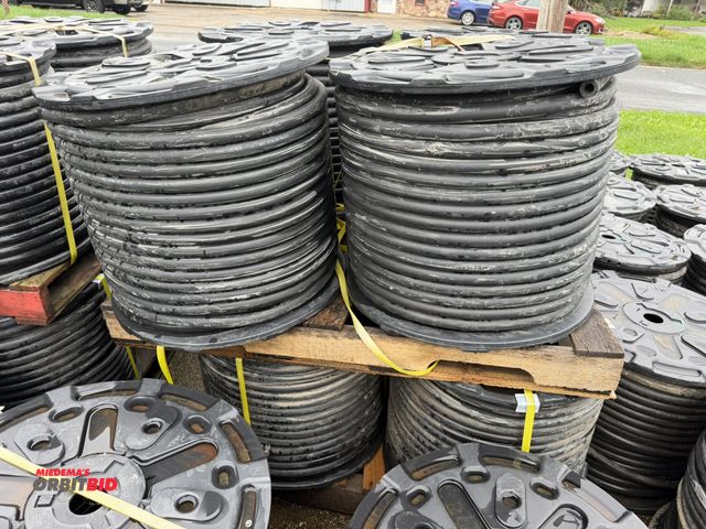 Lot 1-18735 - Lot of (8) spools of 1" heavy duty rubber hose, 1" OD with 1/4" wall, approx. 5/8" center diameter, ...
