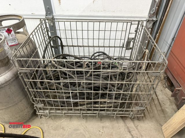 Lot 1-1459 - (1) 33" width x 26" height x 24" depth steel wire basket full of assorted welding leads.