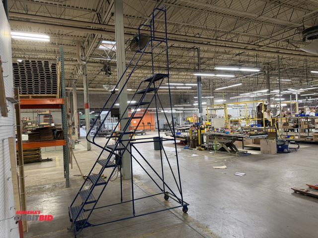 Lot 1-17299 - (1) 10-step rolling safety warehouse ladder.