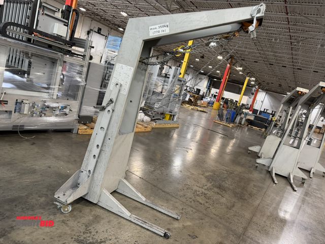 Lot 1-5441 - (1) Muller Martini, 770 lb. max capacity crane/hoist, includes (1) 42" long steel lift attachment.