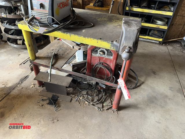 Lot 1-19925 - (1) welding table, 48" x 36" x 35.5" tall, approx. 3/8" thick top, (1) The Chas Parker Company 4 3/4...