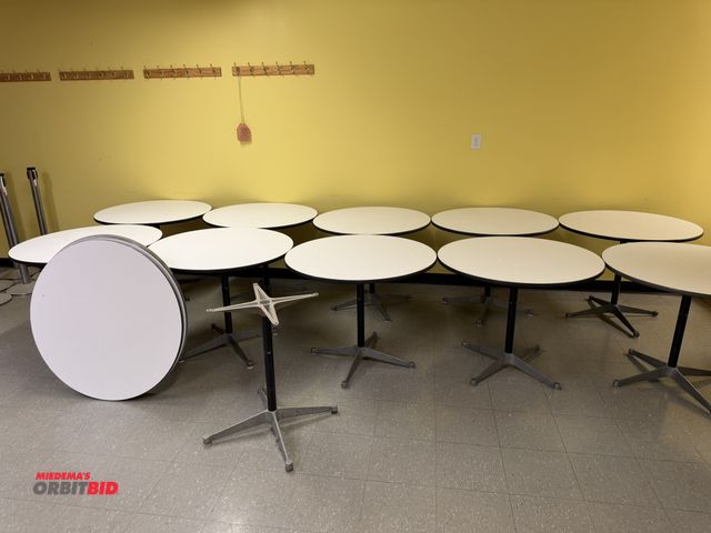 Lot 1-16778 - Lot of (10) Herman Miller 36" diameter single pedestal tables, (4) extra tops, and (1) extra base.