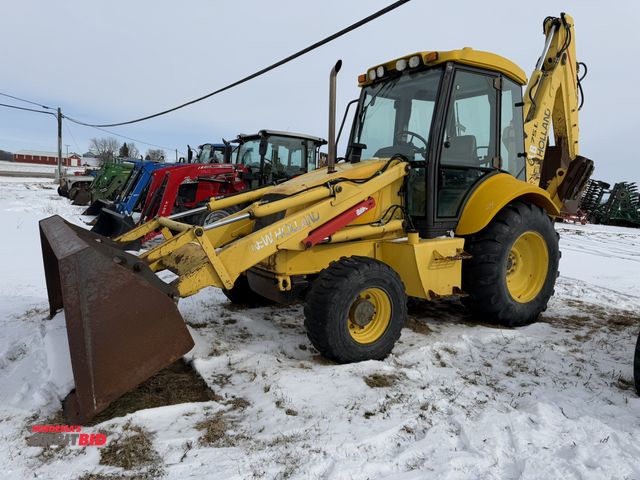 Lot 1-11775 - New Holland LB75B Backhoe Loader S/N 031052083, dual side cab doors, 88" wide front bucket, 3-tooth ...