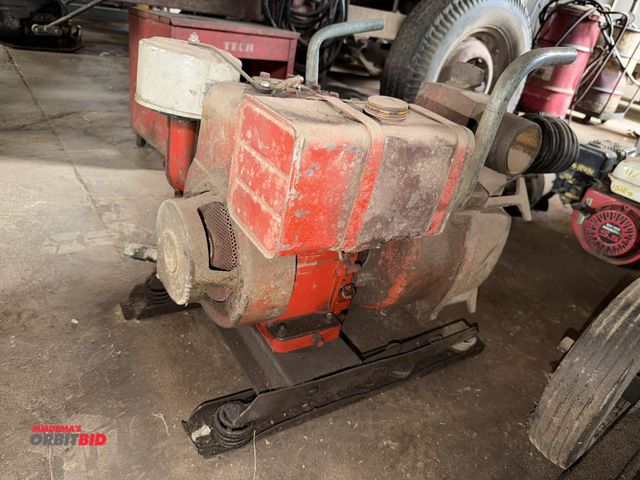 Lot 1-18113 - (1) Homelite portable trash pump with a make and model unknown gas engine, engine is seized, does no...