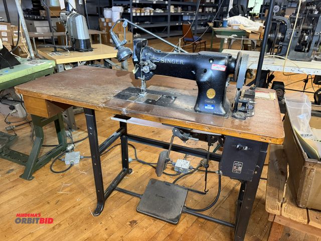 Lot 1-4671 - (1) Singer, model 112W140, commercial sewing machine with a Singer power table, 1/2 HP, 3 phase, sin...