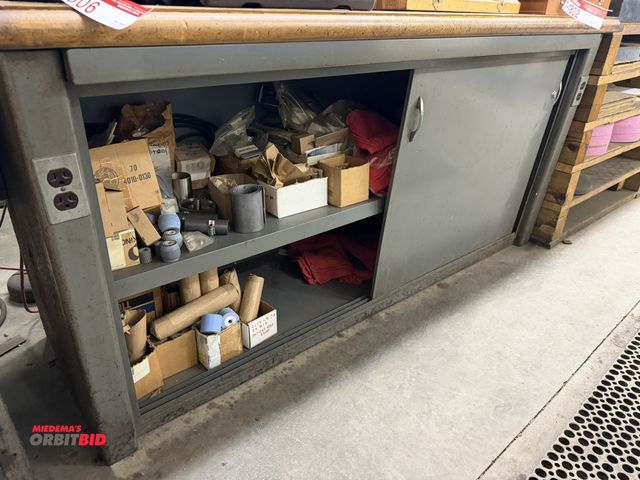 Lot 1-1807 - (1) 2-door metal framed, wood top work bench, 72" x 30", includes assorted clamps, chuck jaws, machi...