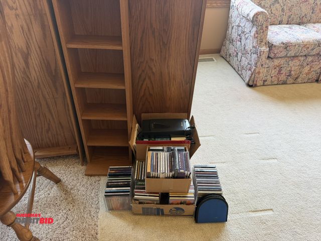 Lot 1-19181 - Large lot of assorted CD's, various artists, and assorted VHS tapes with Memorex VHS rewinder, this ...