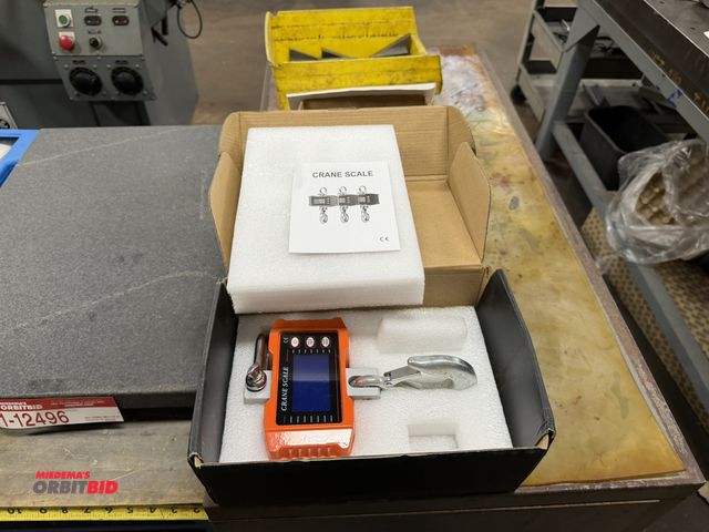 Lot 1-12497 - (1) 1000 Kg capacity crane scale, appears to be in unused condition, with original packaging.