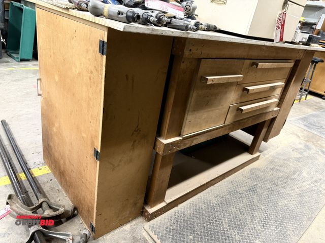 Lot 1-16603 - (1) custom built wood table with 4 pull out drawers, and 2 end cabinets, wood top, measures 83" x 38...