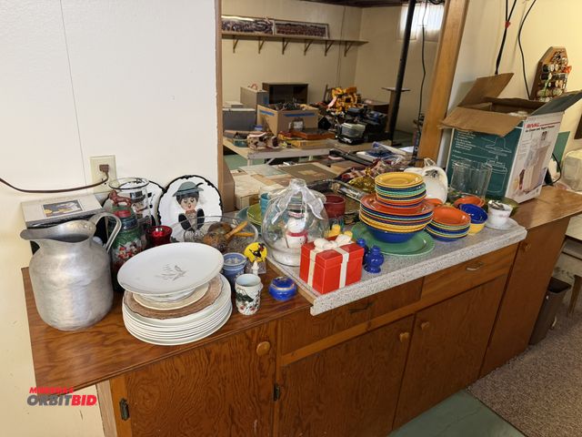 Lot 1-12198 - Large lot of assorted kitchen dishes and plates, includes casserole pans, cups, pitchers, glass vase...