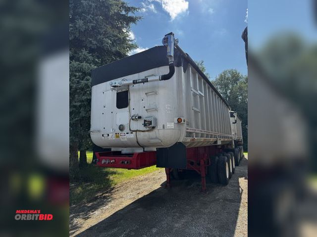 Lot 1-6909 - 1987 Fruehauf Triple Ten Dump Trailer dump train, lead triaxle 24' long, 66" sides, Air tailgate ele...