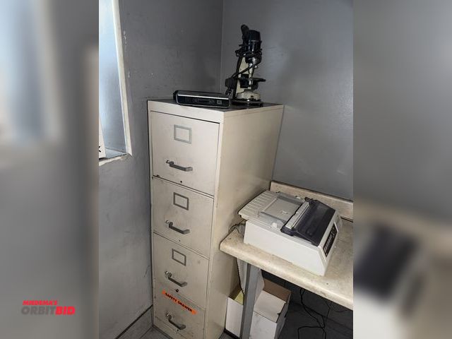 Lot 1-15357 - (1) 4-drawer lateral file cabinet, (1) Dymo battery operated digital scale, and (1) Bausch &amp; Lom...