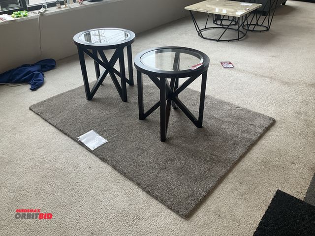 Lot 1-17151 - (2) Round glass top end tables and a rug. Tables are 22” in diameter and 23” tall. Rug is 72” by 52”