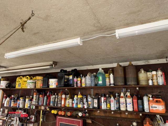 Lot 1-12121 - Contents of sprays and oils on shelf, winning bidder responsible for proper removal of all items.