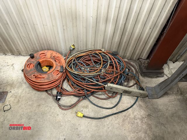 Lot 1-15145 - Lot of assorted electrical cords with (1) cord reel.