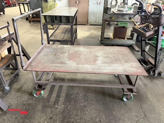 Lot 1-6422 - (1) 60" length x 23" height x 34" depth heavy duty steel flat cart with 6" diameter x 2" wide wheels...