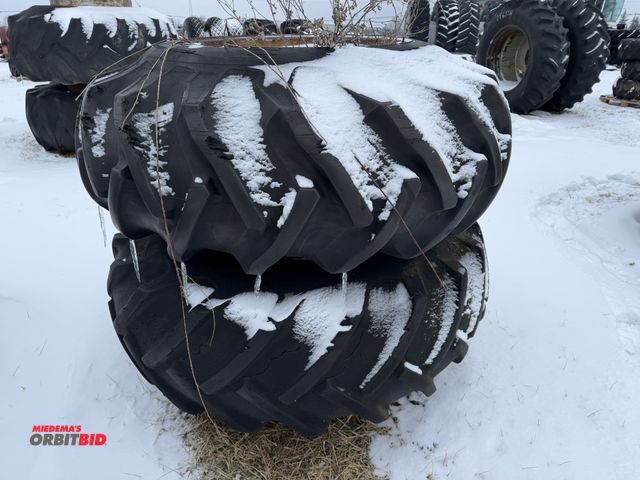 Lot 1-11635 - (1) set of clamp on duals with used Goodyear 18.4-28 tires, tires are cracked and weather checked.