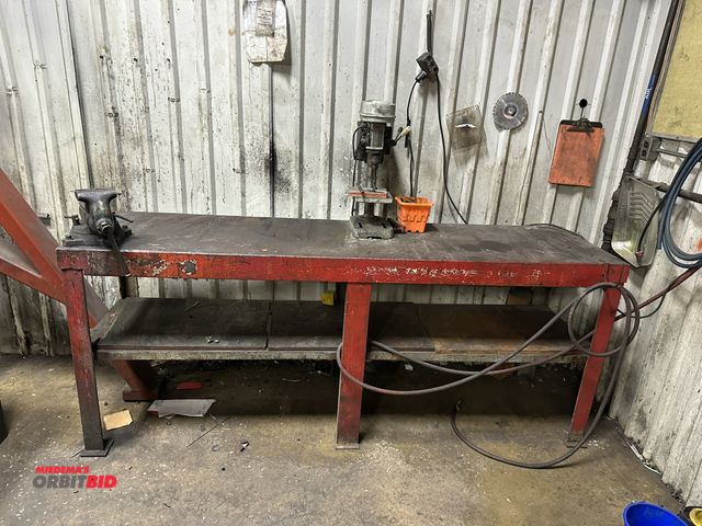 Lot 1-14412 - (1) 90" length x 36-1/2" height x 24" depth heavy duty steel table with mounted 5" bench vise and sh...