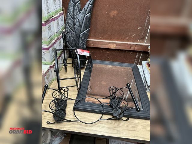 Lot 1-12542 - Decorative Black Frame Mirror, (2) wall plant hangers, wine rack and napkin holder