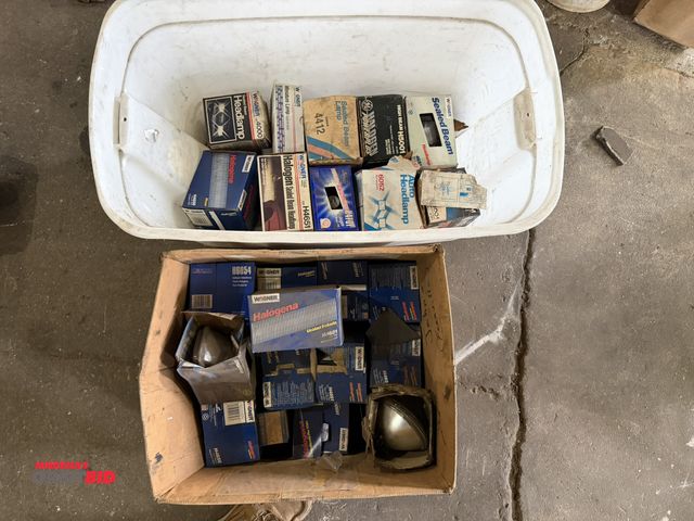 Lot 1-1130 - Large lot of assorted headlights, most appear to be old new stock.