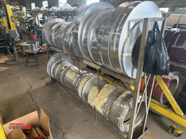 Lot 1-18746 - (1) 87" length x 60" height x 14" depth, 2-tier pipe steel roll stand with assorted clear anodized a...