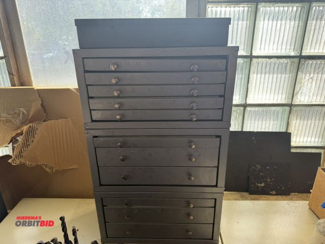 Lot 1-12354 - Lot of (3) 15" width x 8" height x 7" depth drill indexes with assorted drills, and (1) metal drill ...