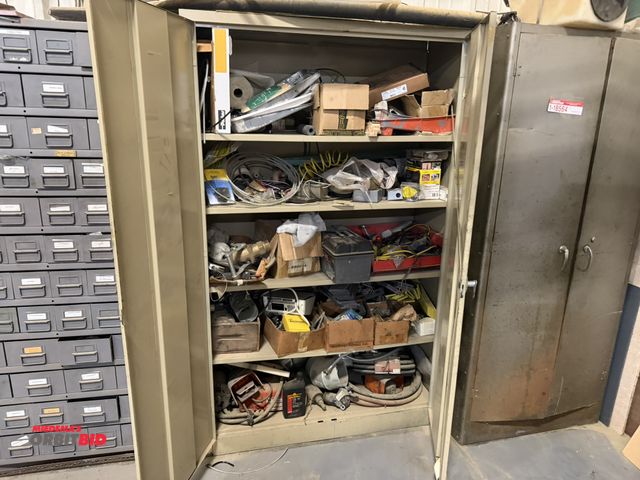 Lot 1-18565 - (1) 48" wide, 2-door metal storage cabinet, with assorted machine parts, includes Flex Gen 50' hose,...