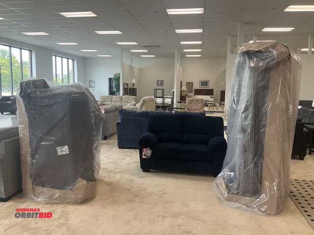 Lot 1-17167 - Signature Design by Ashley living room set. Couch is 80” by 37” deep. Loveseat is 57” by 37” deep. T...