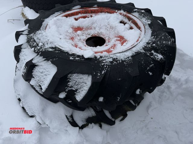 Lot 1-11644 - (1) set of Titan 11.2-24 tires mounted on 8-bolt rims, tires are weather checked.