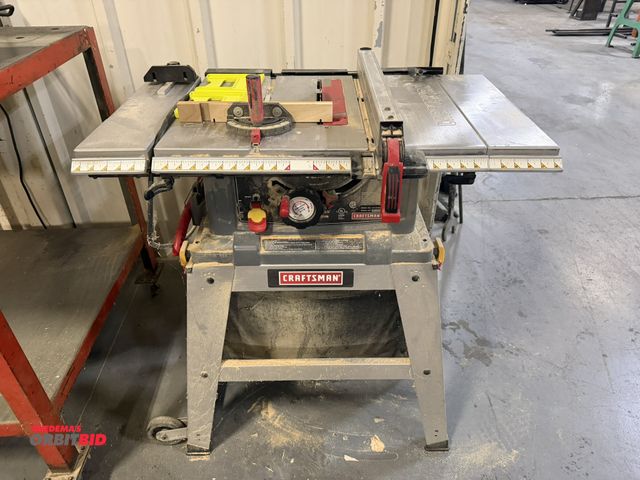 Lot 1-18554 - (1) Craftsman, model 137.218072, 10" table saw, with leg and dust collection bag, 120V, includes gui...