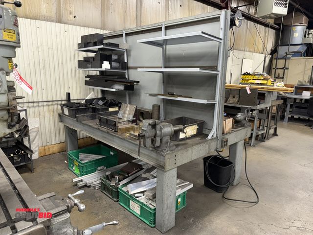 Lot 1-15344 - (1) heavy duty steel frame table, 99" length x 66" width x 33" height, with 5" bench mounted vise, u...