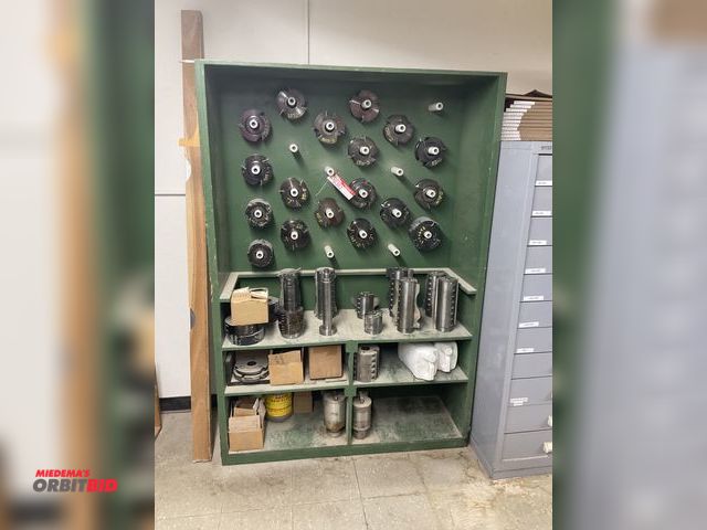 Lot 1-16362 - (1) 49.5" width x 72" height x 16" depth wood cabinet with assorted cylindrical and round shaper cut...