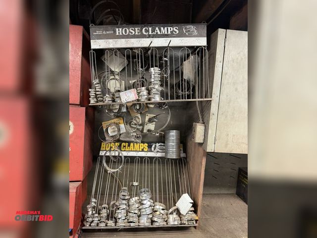 Lot 1-18564 - Lot of assorted hose clamps with (2) wall mount hose clamp organizers.