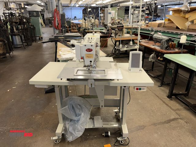 Lot 1-4745 - (1) Robeson NT-2210G programmable stitch sewing machine with power table, 47" wide x 23.5" deep x 32...