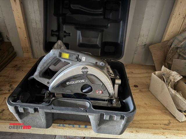 Lot 1-2990 - (1) Evolution EVO 9" circular saw with case, laser cut, and manual, in working condition.