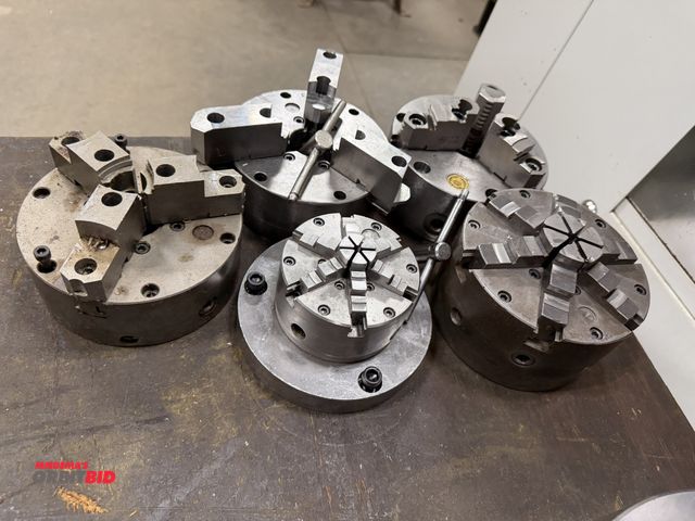 Lot 1-1897 - Lot including (3) 6" 3-jaw chucks, (1) 6" 6-jaw chuck, and (1) 4" 6-jaw chuck.