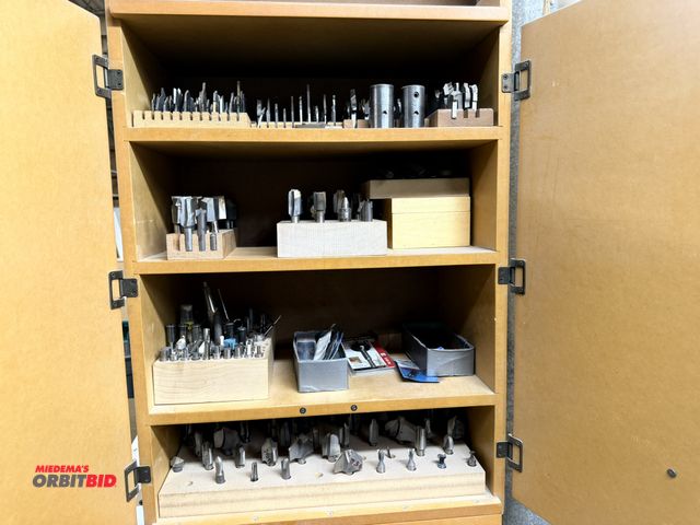 Lot 1-16616 - (1) 2-door cabinet filled with assorted router bits, some new/some used, various sizes and styles, w...