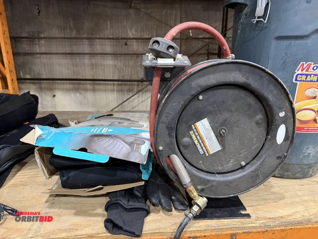 Lot 1-18660 - (1) Central Pneumatic retractable hose reel, with 25' of air hose, (1) wet suit seat cover, and pair...