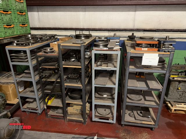 Lot 1-18736 - Large lot of miscellaneous dies, (3) racks with casters, winning bidder responsible for proper remov...