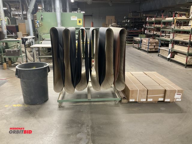 Lot 1-16524 - (1) Baker Metal Products rolling belt rack, approx. 56" x 45.5", with assorted sanding belts, also i...