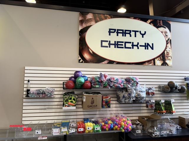 Lot 1-11279 - All prizes on countertop and pegboard wall, includes disco light, Flying Top Super Toys, rings, Cray...