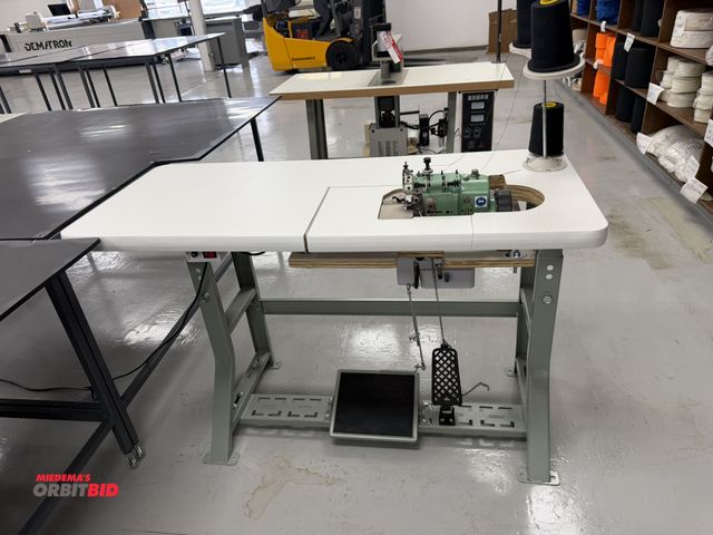 Lot 1-4876 - (1) Merrow, model MG-3DW-2, over seaming sewing machine, S/N 309139, includes power table, foot peda...