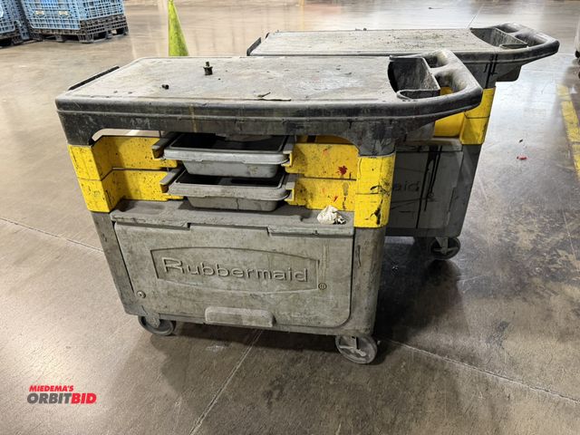 Lot 1-5381 - Lot of (2) Rubbermaid 37" length x 33" height x 18.5" depth utility carts with lower shelf and plast...